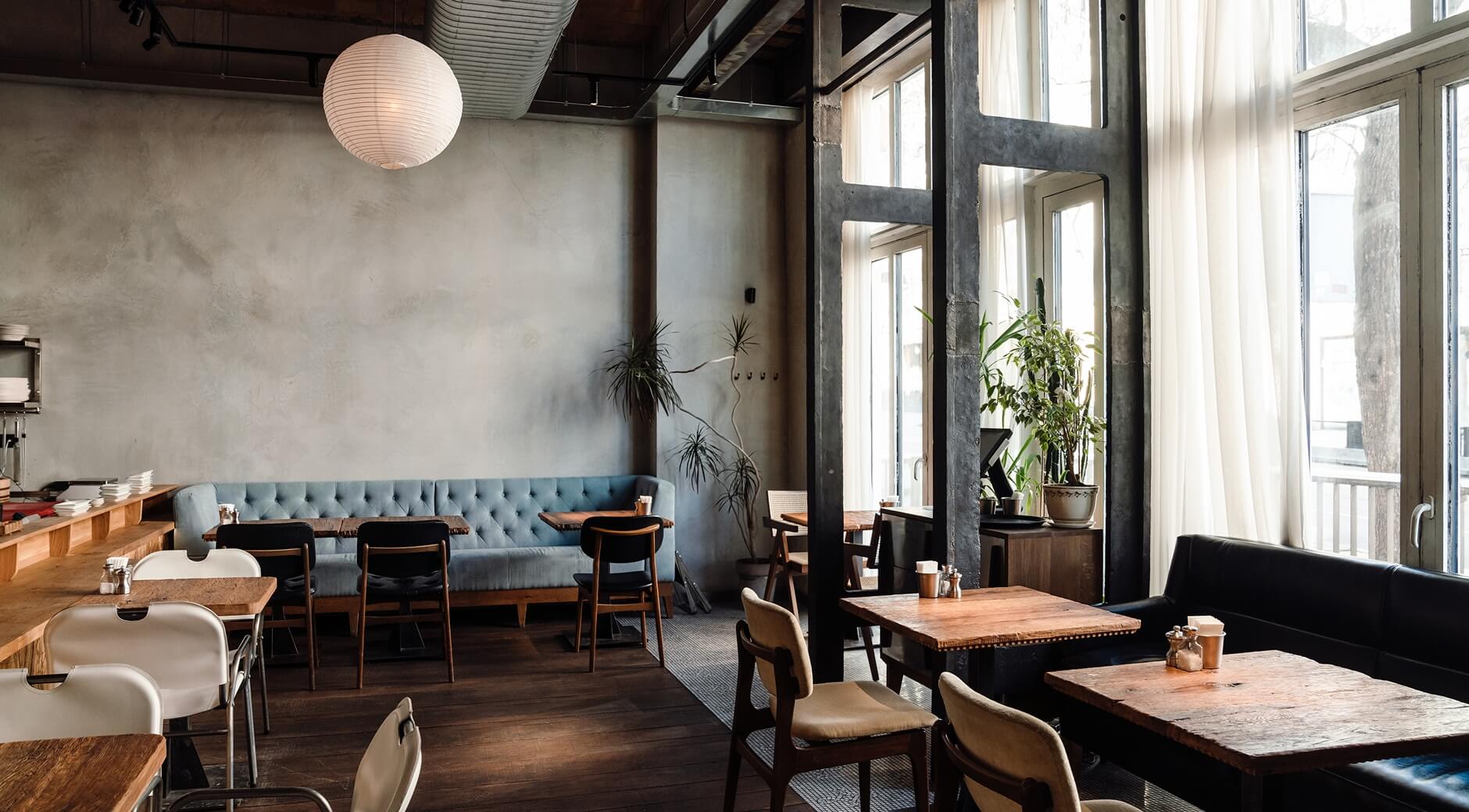 A modern restaurant interior with blue tufted banquette s ...<br /><a href=